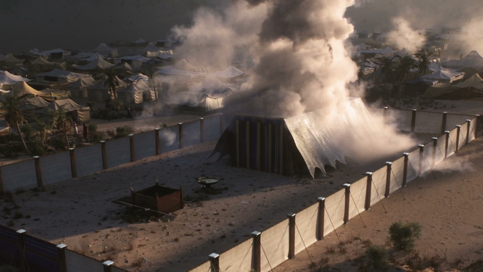 Aerial CG shot of the Tabernacle compound within the Israelite camp, smoke rising